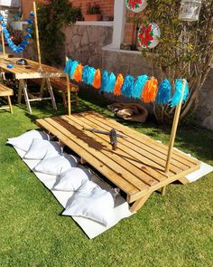 an outdoor area with wooden benches and decorations