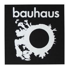 the logo for bauhaus on a black shirt with white paint splatters