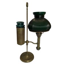 Stunning unconverted kerosene student lamp with stunning original green globe! This is a very rare find to see one still in its original state. Most student lamps were later converted to electrical so this is truly a great find! DIMENSIONS 12ʺW × 8ʺD × 20.5ʺL STYLES American Art Deco Traditional LAMP SHADE Included PERIOD Late 19th Century ITEM TYPE Vintage, Antique or Pre-owned MATERIALS Brass CONDITION Good Condition, Original Condition Unaltered, Some Imperfections COLOR Green Thanks for shop Antique Lamps Vintage Lighting, Traditional Lamp, American Art Deco, Kerosene Lamp, Antique Lamps, Kerosene, Mason Jar Lamp, Desk Lamps, Vintage Lighting