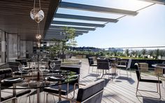 an outdoor dining area with tables and chairs