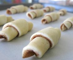 some kind of food that is on a table and ready to be baked in the oven