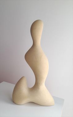 a white sculpture sitting on top of a table