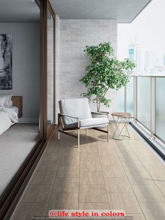 a white chair sitting on top of a hard wood floor next to a bed in a bedroom