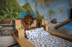 a bed room with a neatly made bed and a pirate ship mural on the wall