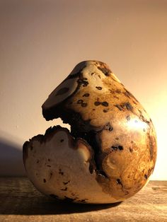 a mushroom sitting on top of a wooden table