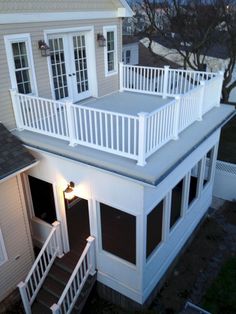 an aerial view of a house with stairs leading up to the upper level and second story