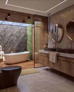 a large bathroom with two sinks and a bathtub