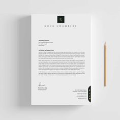 a letterhead with a pencil next to it on top of a white paper that says rock chamberers