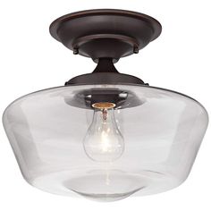 a light fixture with a clear glass shade