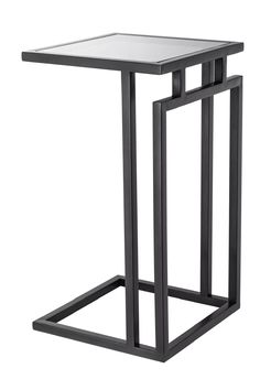 the side table is made from metal and has a square top with an iron frame