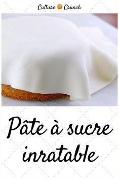 a cake with white frosting on it and the words pate d'sucre in