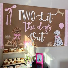 there is a sign that says two set the dogs out with cupcakes and cakes