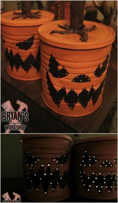 three pumpkins painted on top of two planters with lights in the shape of bats