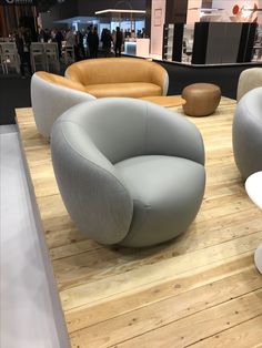 an assortment of modern furniture on display in a store