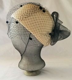 Vintage Women's Hat Juliette Woven beige  straw black net & bow.  The tag says Ruth Ann Designs. It is not quite a Juliette cap, but with the nice Juliette peaked crown.  It is nearly rectangular shaped measuring 7" wide x 8" long on the lining trim.  No damage to the netting or spots.  Please use the photos for the best description. Thank-you for looking! Black Cloche Costume Hat For Church, Black Retro Mini Hat With Short Brim, Adjustable Black Mini Hat For Church, Black Summer Costume Hat One Size Fits Most, Retro Black Hat For Spring, Black Mini Hat With Short Brim, Black Retro Brimmed Mini Hats, Vintage Black Mini Hats For Summer, Retro Black Hat With Short Brim