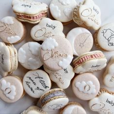 some cookies that have writing on them and are next to each other with wedding rings