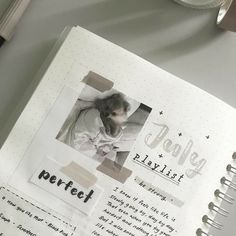 an open page in a scrapbook with the words perfect written on it and a pen next to it