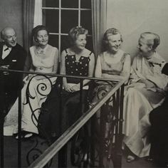 an old black and white photo of four people