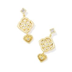 Give your ear stack an eclectic edge with the Lacie Statement Earrings. These charming drop earrings feature princess cut crystals, etched hearts, and medallion shapes designed after the Kendra Scott medallion logo. They're playful, fashionable, and ready to shine. To preserve your fashion jewelry for years to come, agents such as soaps, perfumes, lotions, makeup, hair and cleaning products, and other chemical contact should be avoided. Take care to remove jewelry before showering, sleeping, exe No Buy, Ivory Earrings, Ear Stack, Celestial Jewelry, Accessories Jewelry Earrings, Shape Design, Cleaning Products, Kendra Scott, Princess Cut