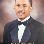 a man in a tuxedo is smiling for the camera while wearing a bow tie