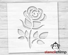 the stencil technique is used to create this rose design on wood planks