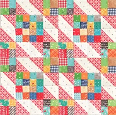 a colorful patchwork quilt with many different colors