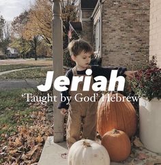 a young boy standing next to two pumpkins on a porch with the words jeriah taught by god hebrew