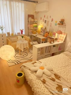 a bedroom with white walls and wooden floors