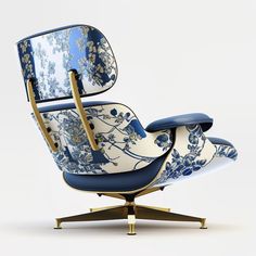 an eames chair with blue and white designs on the back, sitting on a gold base