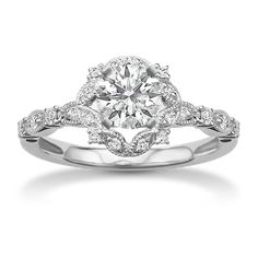 a white gold engagement ring with diamonds on it