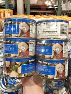 two cans of kirkland's chicken breast soup are stacked on top of each other