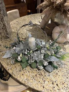 a table topped with a vase filled with flowers