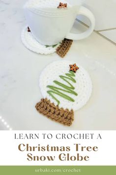 crochet christmas tree snow globe with coffee cup on the side and text overlay that reads learn to crochet a christmas tree snow globe