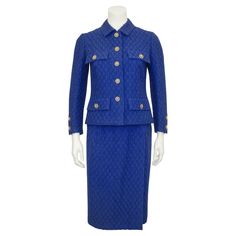 Classic 1980's Chanel Haute Couture skirt suit in royal blue bouclé diamond pattern wool. Jacket is fully lined and finished at the hem with the iconic gold chain. Five royal blue and gold metal lions head buttons up the front with 2 more on each cuff and on the flap of all four jacket pockets. The skirt is designed with an overlap effect and zips on the back of the hip. The condition is excellent with no soil, damage, pilling or other signs of wear. The Chanel couture label is well positioned a Vintage Chanel Outfit, Chanel Outfits Women, Haute Couture Skirt, Haute Couture Skirts, Blue Skirt Suit, Royal Blue Skirt, Royal Blue Skirts, Couture Skirts, Lions Head