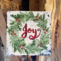 a painted sign with the word joy on it