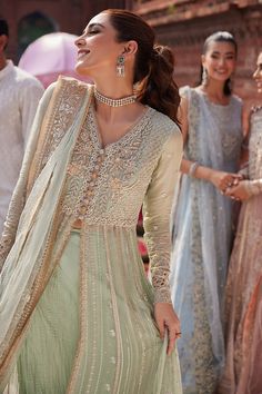 Elegant Mint Green Embroidered Pakistani Wedding Wear Pishwas Frock is a harmonious fusion of hand embellished and embroidered work details on mint green chiffon pishwas, adorned with delicate embroidered and sequinned borders on the ensemble as well as on the dupatta. Each detail including the golden tilla buttons and laces tells a story of meticulous craftsmanship, redefining luxury with its opulent charm. Pishwas: Pakistani Pishwas in premium Chiffon is an elegant choice to wear at a wedding. Frock Models, Pakistani Wedding Outfits, Chiffon Collection, Desi Fashion, Pakistani Wedding, How To Dye Fabric, Embellished Dress, Pakistani Fashion, Wedding Wear