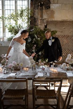 the bride and groom are preparing to cut their wedding cake