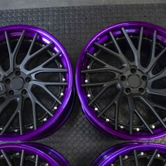 four purple rims are shown in this image