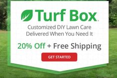 a lawn mower sitting on top of a green grass covered field next to a sign that says turf box