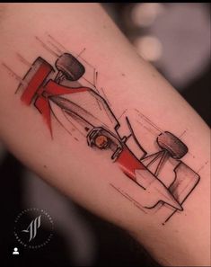 a tattoo design of a racing car on the right upper arm and lower leg with red tape around it