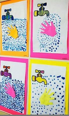 handprints are displayed on the wall in front of a child's artwork