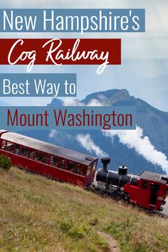 a red train traveling down tracks next to a lush green hillside with mountains in the background