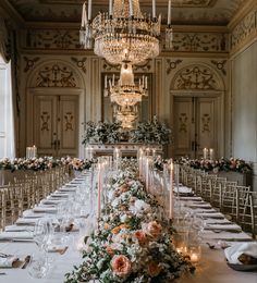 a long table is set with candles and flowers for a formal dinner or wedding reception