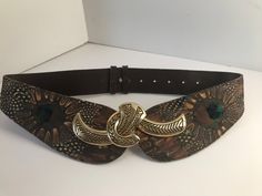 Vintage 80s genuine Peacock Feather and brown leather belt with gold buckle, Vintage Peacock adjustable leather belt large gold toned buckle by GypsiesOutWest on Etsy Luxury Gold Western-style Belts, Luxury Vintage Belt With Brass Buckle, Vintage Brown Leather Belt With Removable Feature, Luxury Vintage Brass Belt Buckle, Western Brown Antique Buckle Belt, Brown Leather Belt, Vintage Belts, Peacock Feathers, Peacock Feather