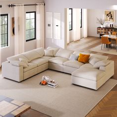 a living room with a sectional couch and coffee table in the corner, on top of a carpeted floor