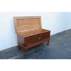 an old wooden chest sitting against a wall