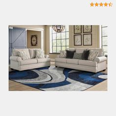 a living room with two couches and a rug