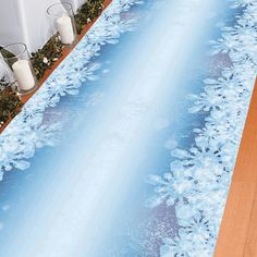 the floor is covered with blue flowers and water in front of a white table cloth