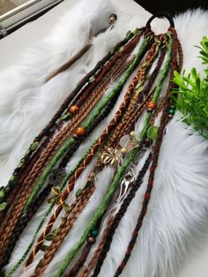 Elevate your look with this stunning Forest Vibes Dreadlock Ponytail Set. Featuring a mix of brown and green synthetic dreads on a secure elastic band, this accessory exudes natural charm and bohemian vibes. Perfect for festivals, parties, or everyday wear. Stand out from the crowd with this unique and stylish hair piece! Unleash your inner forest spirit with our Brown and Green Synthetic Dreadlock Ponytail Set. Handcrafted with care, this set offers a blend of earthy tones that perfectly captur Dreadlock Ponytail, Goblincore Outfits, Hair Frizz Control, Control Frizzy Hair, Forest Vibes, Bohemian Hair Accessories, Dreadlock Jewelry, Dreadlock Accessories, Bohemian Vibes