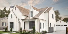 a white house with black shutters on the front and side windows, grass in front